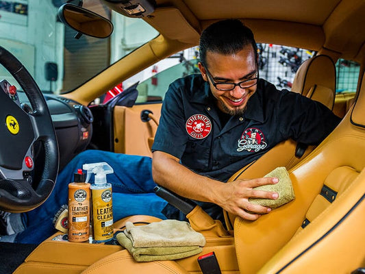 Man Cleaning Leather Ferrari Seats