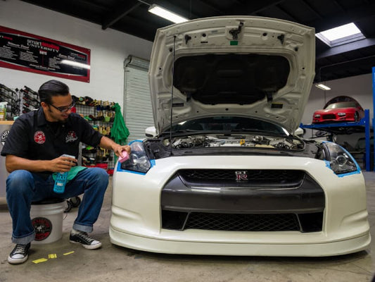 Headlights being Restored on a White GT R