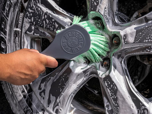 Chemical Guys Brush Used to Clean a Car Wheel